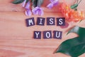 Miss you tag with flower on  table Royalty Free Stock Photo