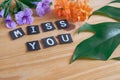 Miss you tag with flower on wtable Royalty Free Stock Photo