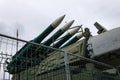 Missile launch rocket launcher behind an iron fence at a military base