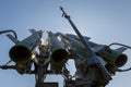 Missiles of the Russian self-propelled medium-range surface-to-air missile system Buk-M2 against the blue sky and sun