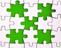 Missing jigsaw puzzle on green background with customizable space for text or ideas. Copy space Royalty Free Stock Photo