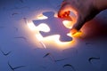 Missing jigsaw puzzle piece with light glow Royalty Free Stock Photo