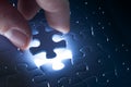 Missing jigsaw puzzle piece with light glow Royalty Free Stock Photo