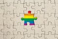 Jigsaw puzzle piece and rainbow flag. Lgbt pride concept