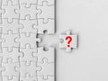 Missing piece of the jigsaw puzzle, question mark on white puzzle piece