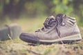 Missing and poverty concept: Abandoned shoe lying on the dusty ground Royalty Free Stock Photo