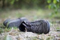 Missing and poverty concept: Abandoned shoe lying on the dusty ground