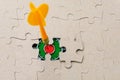 Missing puzzle piece and framed dartboard. Background with copy space Royalty Free Stock Photo