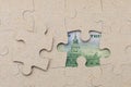 Missing puzzle piece and framed US dollars. Background with copy space Royalty Free Stock Photo