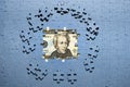 Missing puzzle pieces on money background, hidden assets, hidden fees, key to success concept Royalty Free Stock Photo