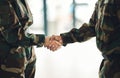 Mission, army or shaking hands for partnership, teamwork or deal in war, agreement or unity together. People, soldiers Royalty Free Stock Photo