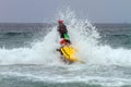 MISSION BAY, CA-USA-11 JULY 2018 - Lifeguard busts through break