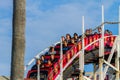 MISSION BAY, CA-USA-11 JULY 2018- People ride Giant Dipper Roller Coaster at Belmont Park. Child crouches in fear. The Mission Be