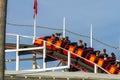 MISSION BAY, CA-USA-11 JULY 2018- People ride Giant Dipper Roller Coaster at Belmont Park. Going up, shows wheels on track. The M