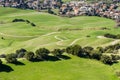 Mission Peak hiking trail on the verdant hills of South San Francisco Bay Area; residential community visible at the base of the Royalty Free Stock Photo