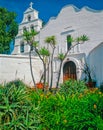 Mission San Diego de Alcala is surrounded by greenery in San Diego, California