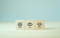 Mission, vision and values of company. Purpose business concept. The wooden cubes with mission, vision and values symbols on grey Royalty Free Stock Photo