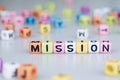 Mission word text written on colorful cube with bokeh cube word