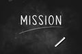 Mission written with chalk on blackboard icon logo design vector illustration Royalty Free Stock Photo