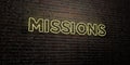 MISSIONS -Realistic Neon Sign on Brick Wall background - 3D rendered royalty free stock image