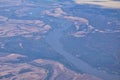 Mississippi River aerial landscape views from airplane over the border of Arkansas and Mississippi. Winding river and Rural town a Royalty Free Stock Photo