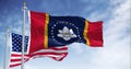 The Mississippi state flag waving along with the national flag of the United States of America Royalty Free Stock Photo