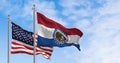 Missouri state flag waving with the national american flag on a clear day Royalty Free Stock Photo