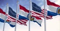 Missouri state flags waving with the national american flag on a clear day Royalty Free Stock Photo