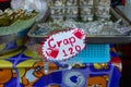 A misspelt food sign at a street food market stall in Krabi, Thailand, the sign reads Crap when it should be Crab