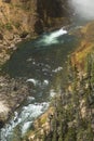 MIst at the bottom of Lower Falls, Yellowstone River, Wyoming. Royalty Free Stock Photo