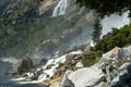 Mist Flies Off of Wapama and Tueeuala Falls in Yosemite National Park Royalty Free Stock Photo