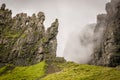 Mist or fog passing through the pass in the mountains. clouds going through a valley