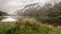 Mist hanging over the lake before the mountains