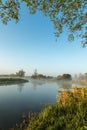 Mist hanging over river Nene in Northamptonshire at sunrise