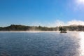 Mist on a lake in early morning Royalty Free Stock Photo