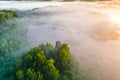 Mist over mixed forest at sunrise, aerial landscape. Temperature contrast concept. Foggy morning Royalty Free Stock Photo