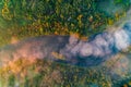 Mist over the river in fall, aerial