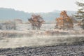 Mist rising off recently ploughed fields on frosty october morning Royalty Free Stock Photo