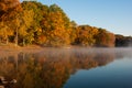 Mist rolls in and rises up to meet the brilliant autumn colors