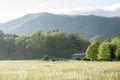 Mist and smoke rises from the hills at sunset Royalty Free Stock Photo