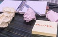 Mistake written on sticky notes. Learning, wrong, blooper, error message, regret sayings background. Fault, defect, careless,