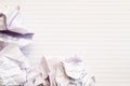Empty lined paper with crumpled balls of paper beside Royalty Free Stock Photo
