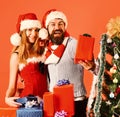 Mister and Missis Claus with red and blue presents Royalty Free Stock Photo