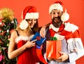 Mister and Missis Claus with red and blue presents Royalty Free Stock Photo