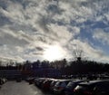 Mistique. Sun on the horizont. Parking space. Cars. Clouds and sun. Royalty Free Stock Photo