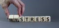 Mistress or stress symbol. Businessman turns wooden cubes and changes the word `mistress` to `stress`. Beautiful grey backgrou Royalty Free Stock Photo