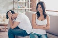 Mistrust and cheat problems. Annoyed couple is ignoring each other, sitting on the couch upset indoors at home. I am not talking Royalty Free Stock Photo