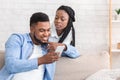 Jealous Wife Peeking How Her Husband Texting On Phone