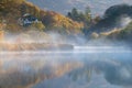 Misty autumn dawn by a river in the Lake District