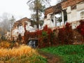 Misty autumn landscape with Ruins and waterfall in park Royalty Free Stock Photo